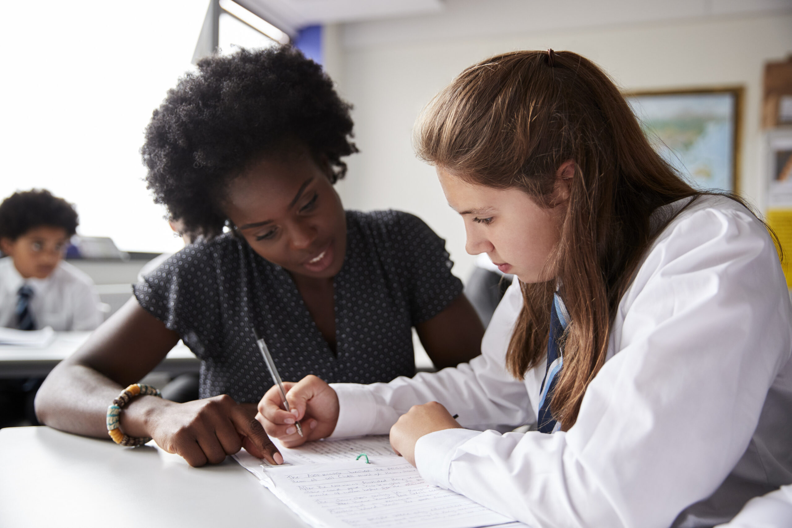 Tutor and high school student working together